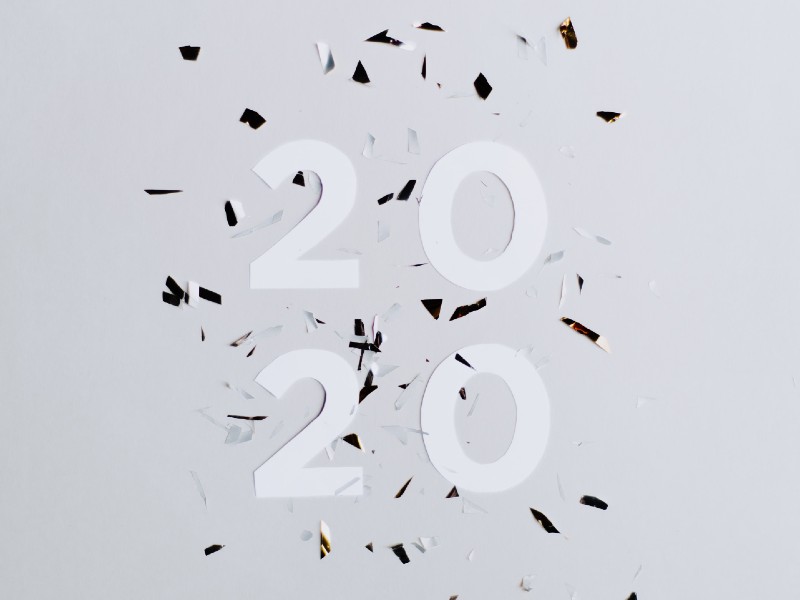 Confetti and paper cut-outs of the number 2020