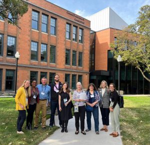 Group from the National Conference of State Legislatures in front of Campbell Hall